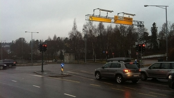 Two overhead signs (one for for the left car lane, one for the right) are both without text
